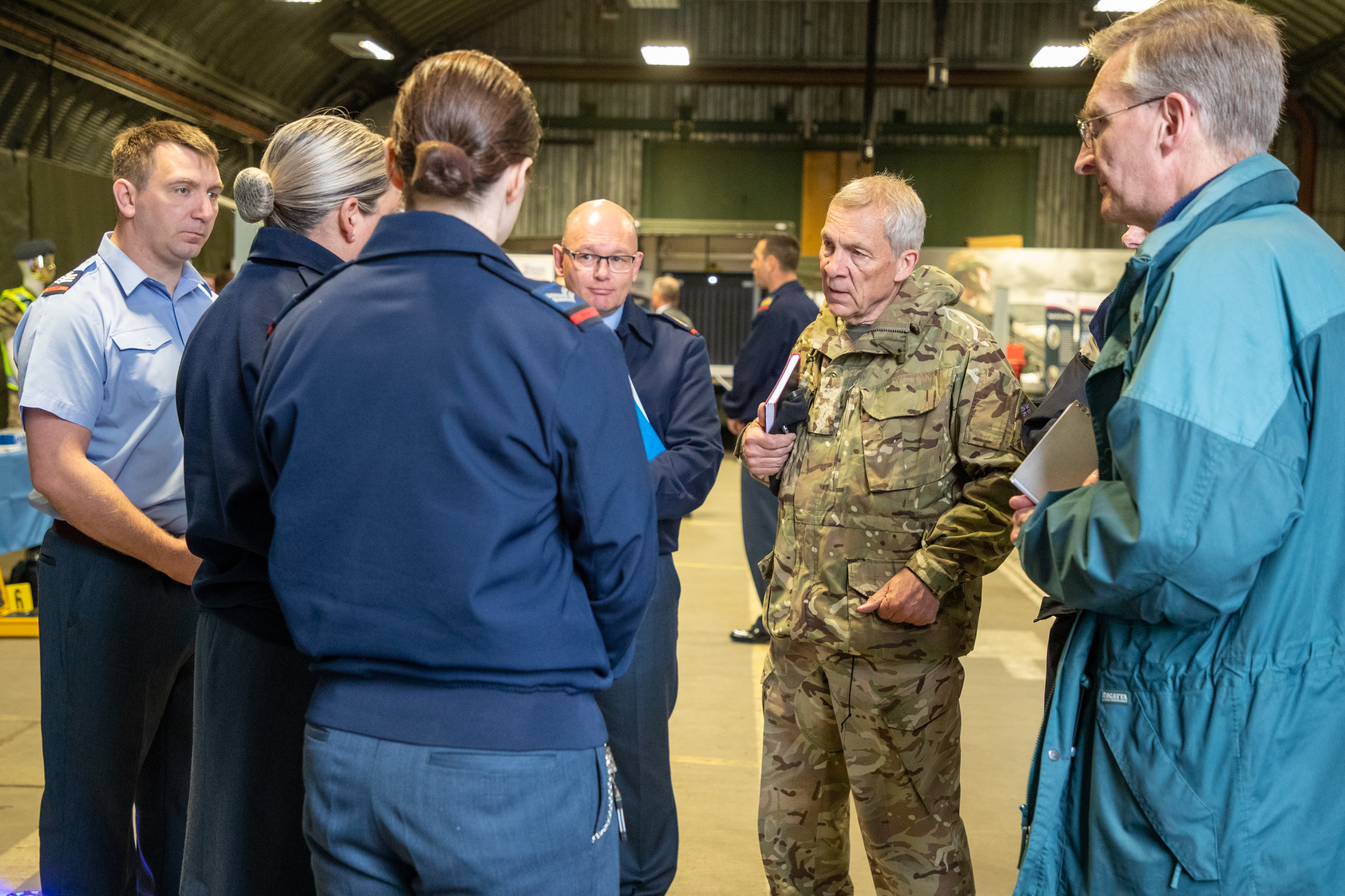 RAF aviators stand in discussion. 